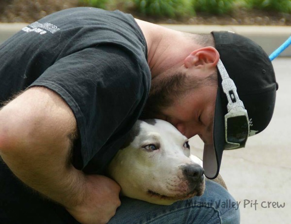 About Miami Valley Pit Crew page Blake holding abused pit bull..